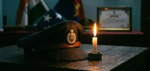 Assam Police cap and candle symbolizing tribute to constable Amlanjit Borthakur.”