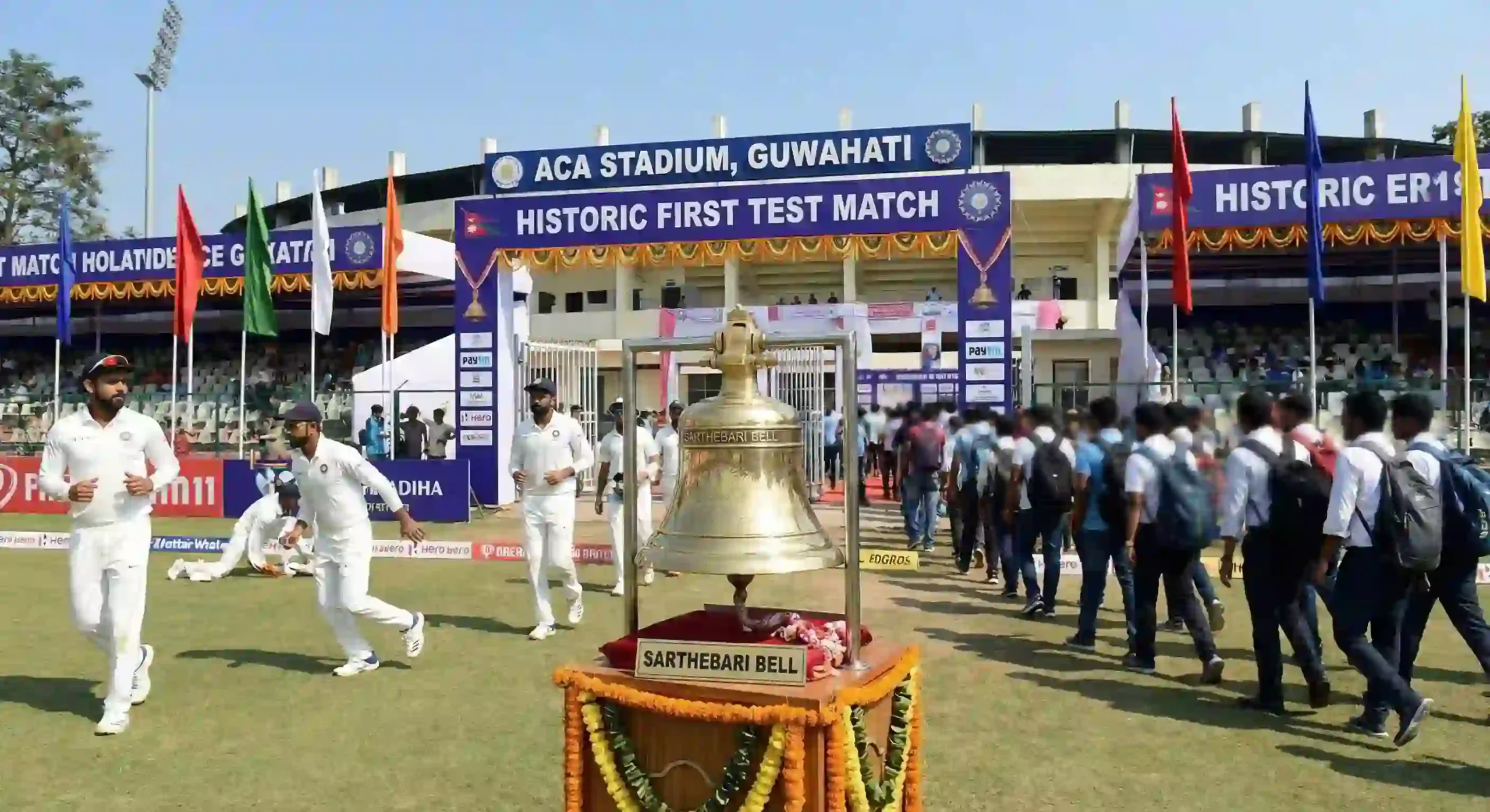 ACA Stadium in Guwahati prepared for its first-ever Test match with ceremonial Sarthebari bell displayed before play.